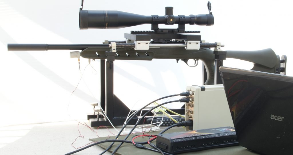 First iteration of David Bookstaber's Universal Precision Firearm Test Fixture, holding a 10/22 rifle with instrumentation for measuring recoil.